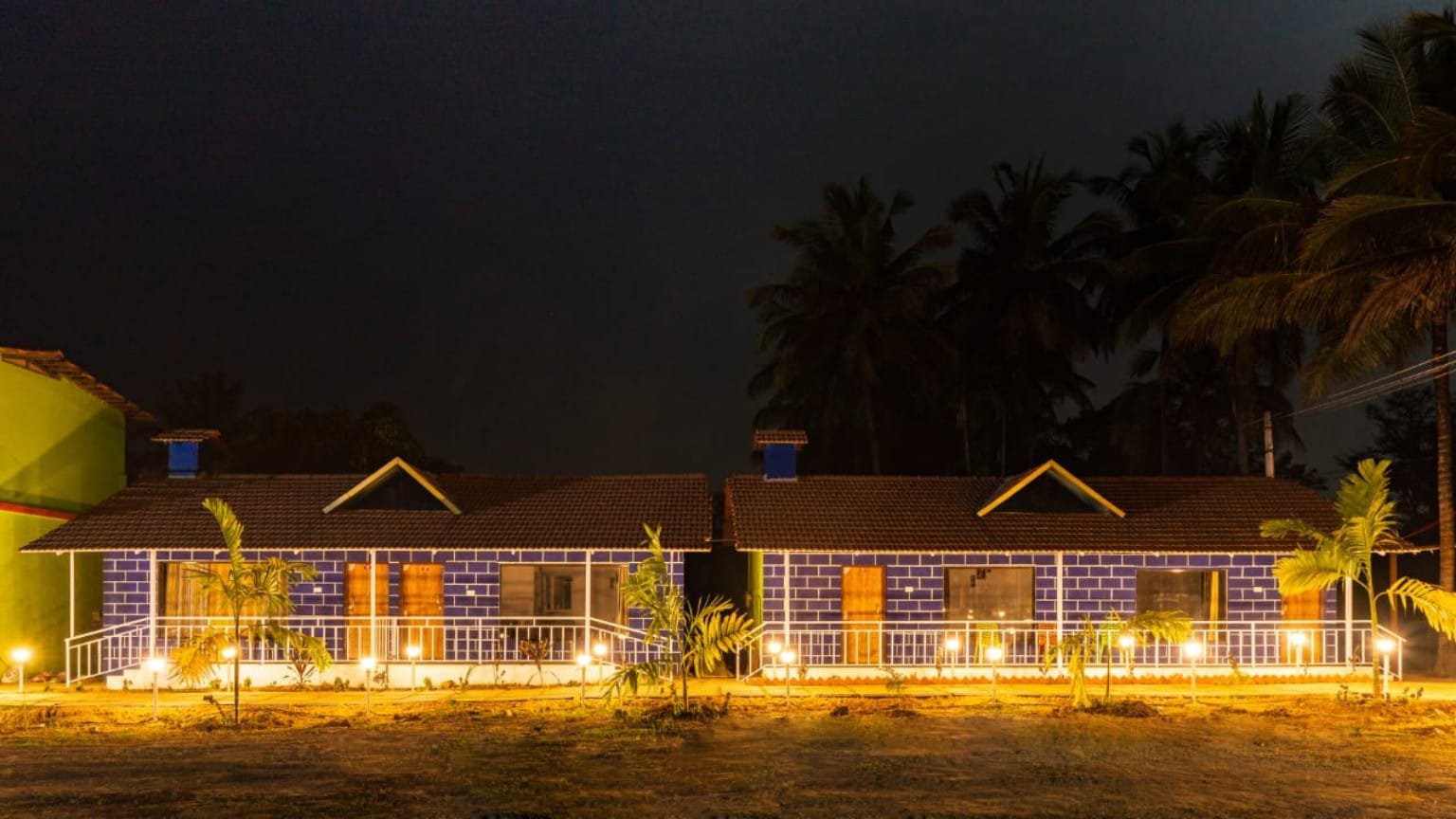 Eco Green Dandeli cottage exterior at night